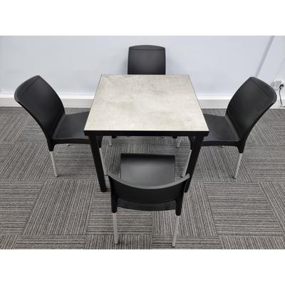 Kelly Ceramic Table in Concrete with 4 Alina Black Side Chairs